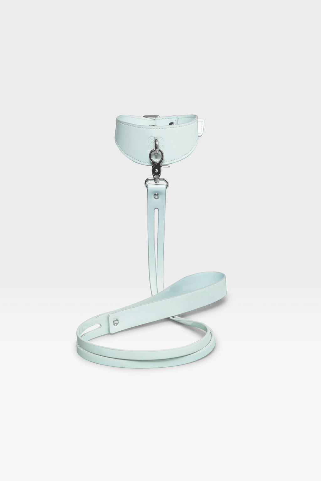 Adjustable buckle closure on the wide-silhouette Cyber Mint vegan leather collar.