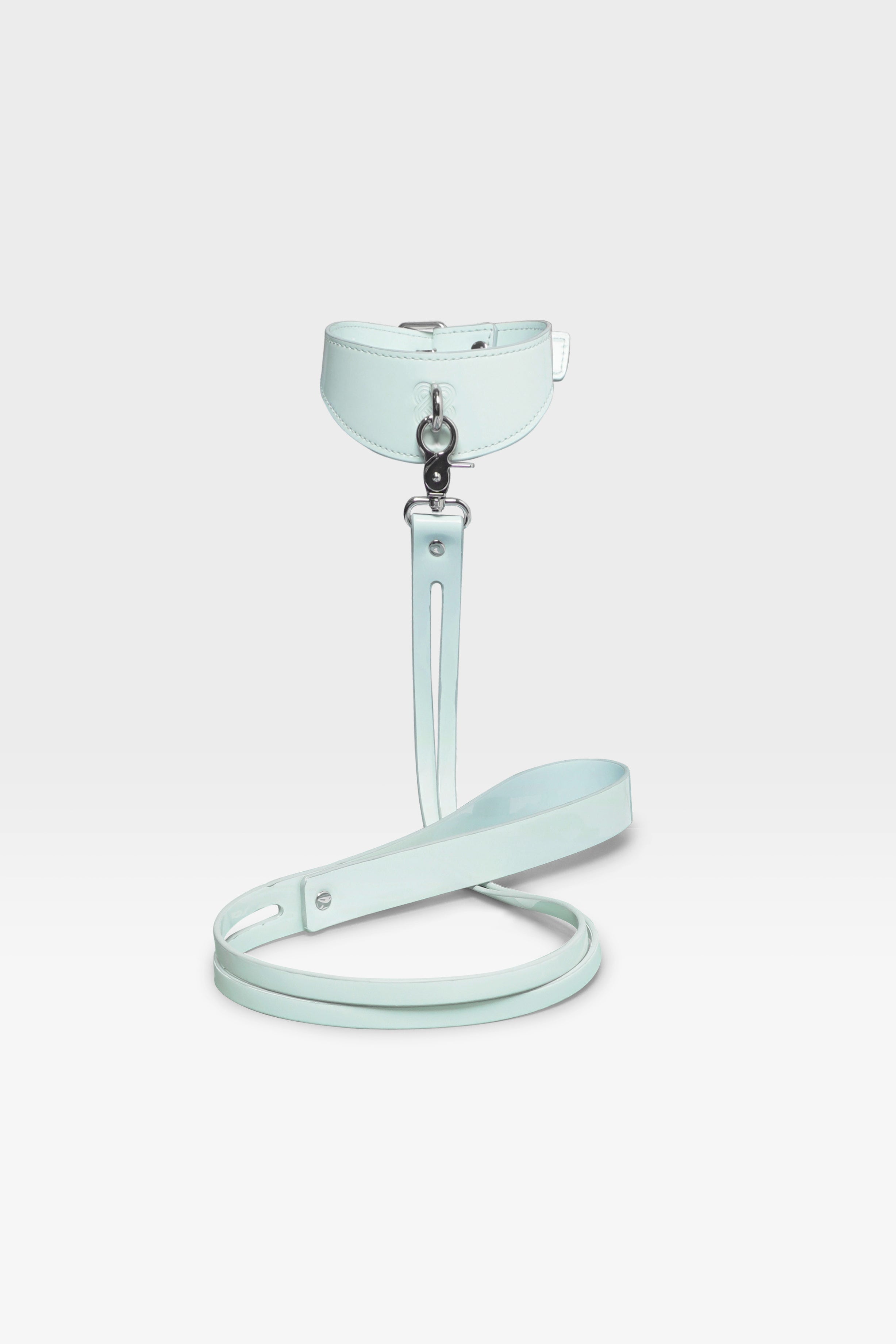 Adjustable buckle closure on the wide-silhouette Cyber Mint vegan leather collar.