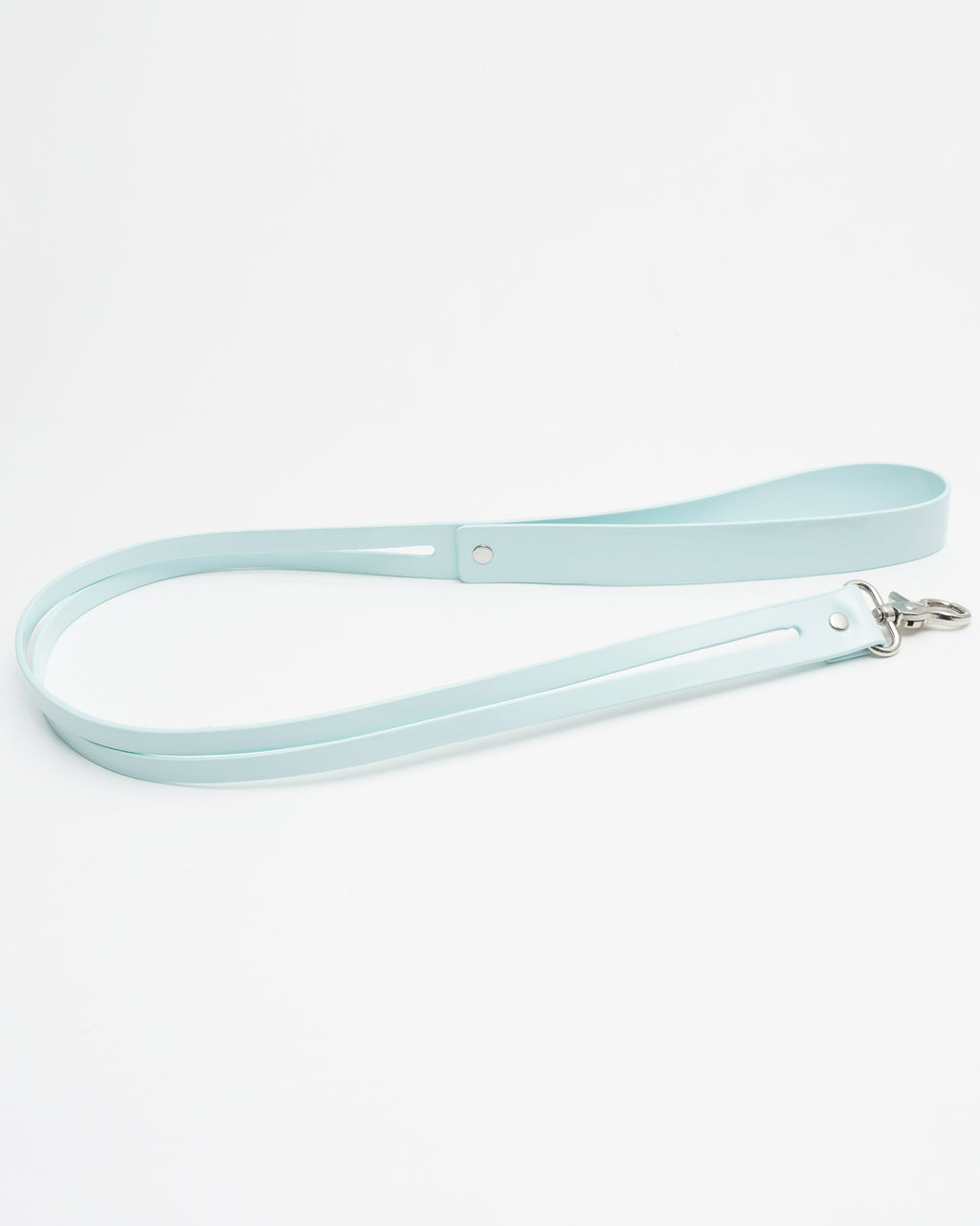 Close-up of the oversized industrial spring-clasp on the Cyber Mint Kinetic Tether, showing the seamless connection to the collar.