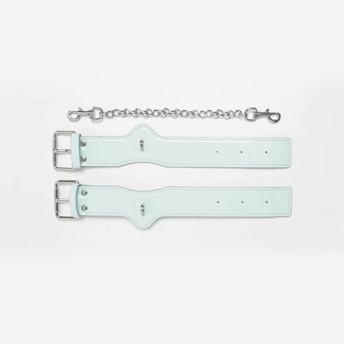 Cyber Mint patent leather wrist braces featuring signature Shibari-inspired embossing.
