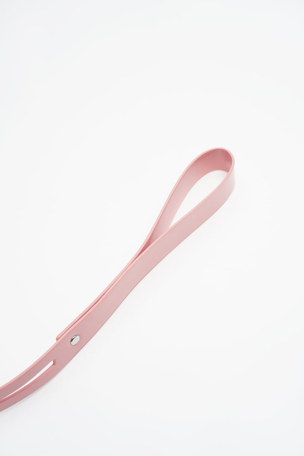 Adjustable buckle closure and reinforced stitching on a premium pink vegan leather collar.